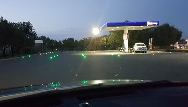 road studs on a nighttime road improving lane visibility