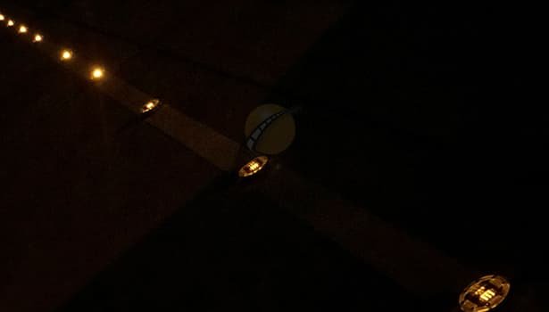 Long road illuminated by continuous solar stud lights