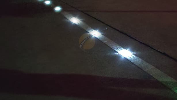 solar road stud lighting up the road