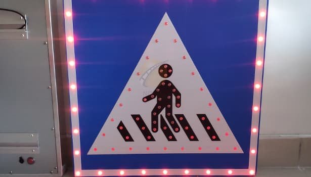 Solar-powered pedestrian crossing sign ensuring nighttime safety